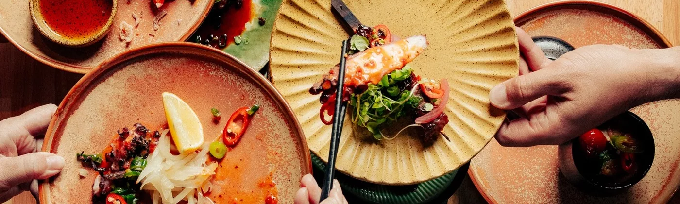  Vietnamese food plated on earthy tone crockery