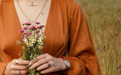 female holding a bunch of flowers wearing jewelley from Montys