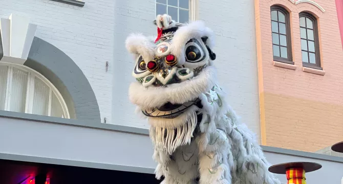 white chinese lion on high jong poles